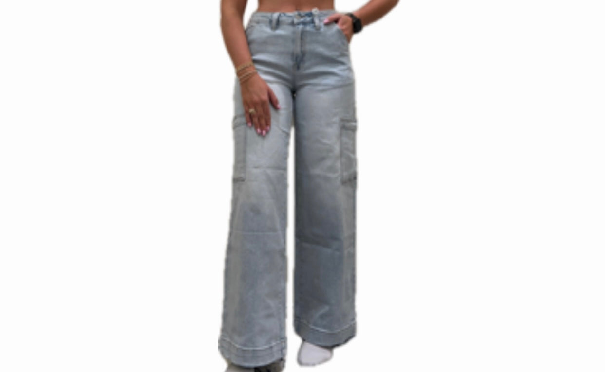 A person standing wearing Charli Cargo Jeans with a wide straight-leg fit and angled side pockets.