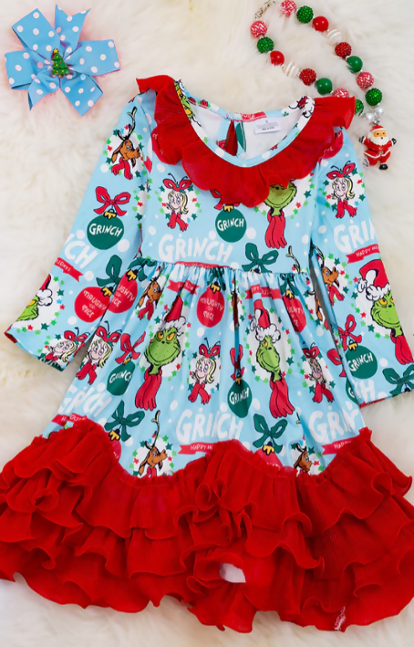 Grinch printed on lt. blue dress with red ruffle hem.